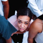 concerned-woman-surrounded-by-people